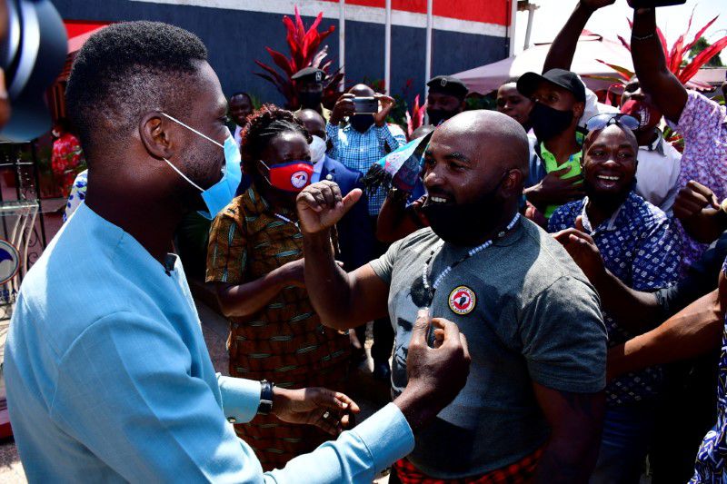 Former presidential candidate Robert Kyagulanyi, also known as Bobi Wine, celebrates with member of his security detail Eddie Ssebuufu, after Ssebuufu's release on bail, at their party's headquarters in Kampala, Uganda June 14, 2021. REUTERS/Abubaker Lubowa