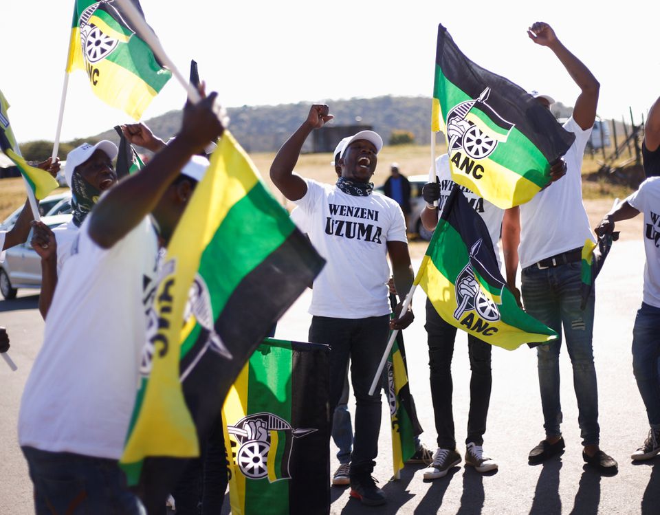 Supporters of former South African President Jacob Zuma who was sentenced to 15 months imprisonment by the Constitutional Court sing and dance in front of his home in Nkandla, South Africa, July 2, 2021. REUTERS/Rogan Ward