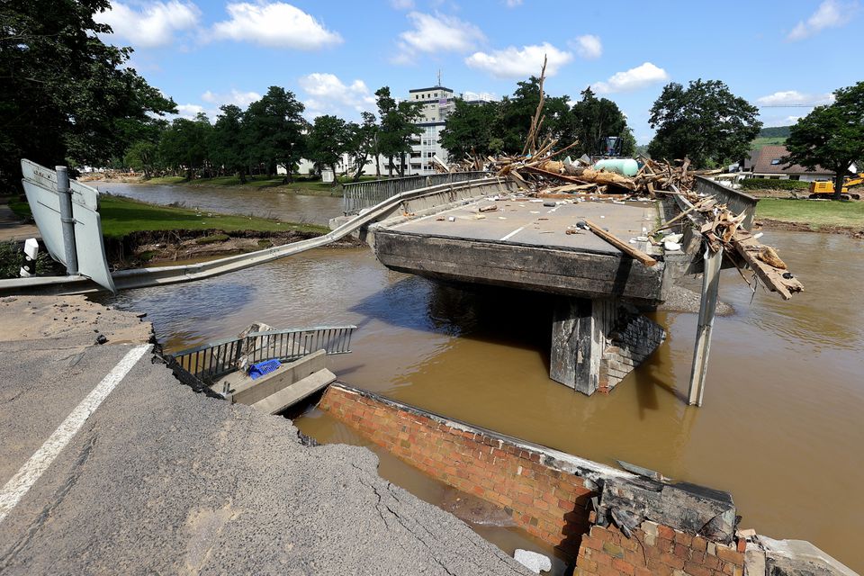 A damaged bridge with a missing part is pictured following heavy rainfalls in Bad Neuenahr-Ahrweiler, Germany, July 18, 2021. REUTERS/Wolfgang Rattay