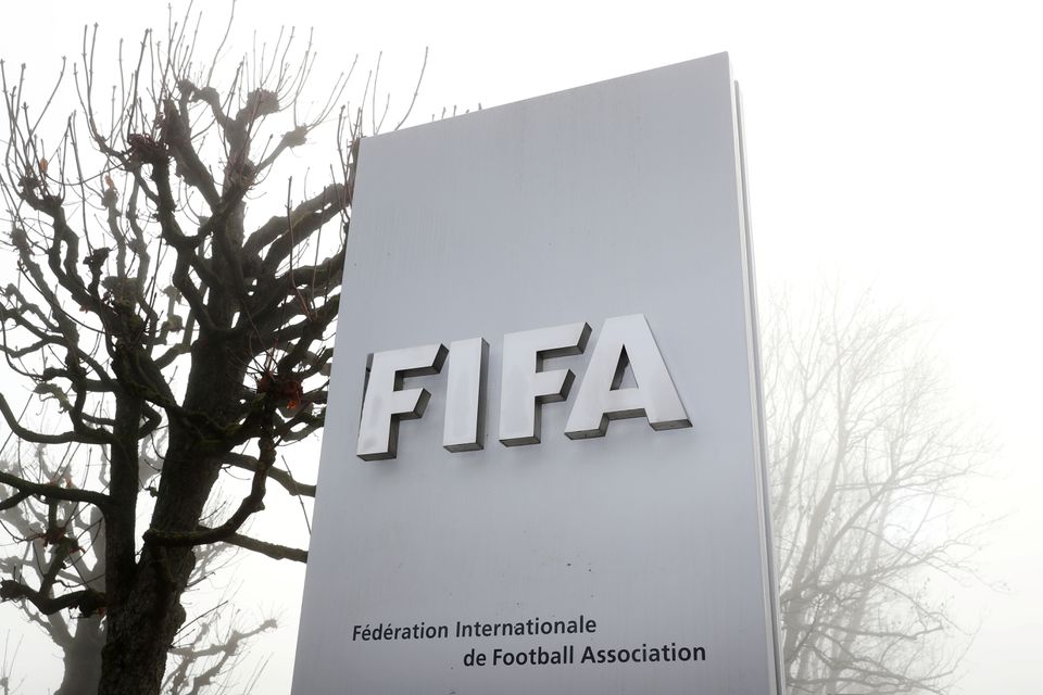 FIFA's logo is seen in front of its headquarters during a foggy autumn day in Zurich, Switzerland November 18, 2020. REUTERS/Arnd Wiegmann