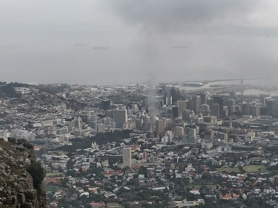 Smoke rises from a burning building in Cape Town, South Africa, January 2, 2022, in this picture obtained from social media. Rowan Spazzoli/via REUTERS THIS IMAGE HAS BEEN SUPPLIED BY A THIRD PARTY. MANDATORY CREDIT.