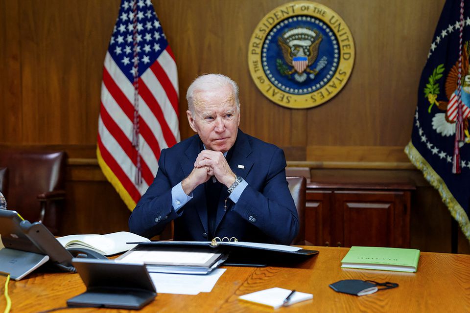 U.S. President Joe Biden speaks on the phone with Russia's President Vladimir Putin about a possible Russian invasion of Ukraine, as Biden spends the weekend at the U.S. presidential retreat at Camp David, in this official White House handout photo released after the call took place in Thurmont, Maryland, U.S., February 12, 2022. The White House/Handout via Reuters